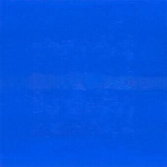 Textured blue surface with granular quality, displaying a medium saturated tone and horizontal gradient, creating a tactile visual impression.